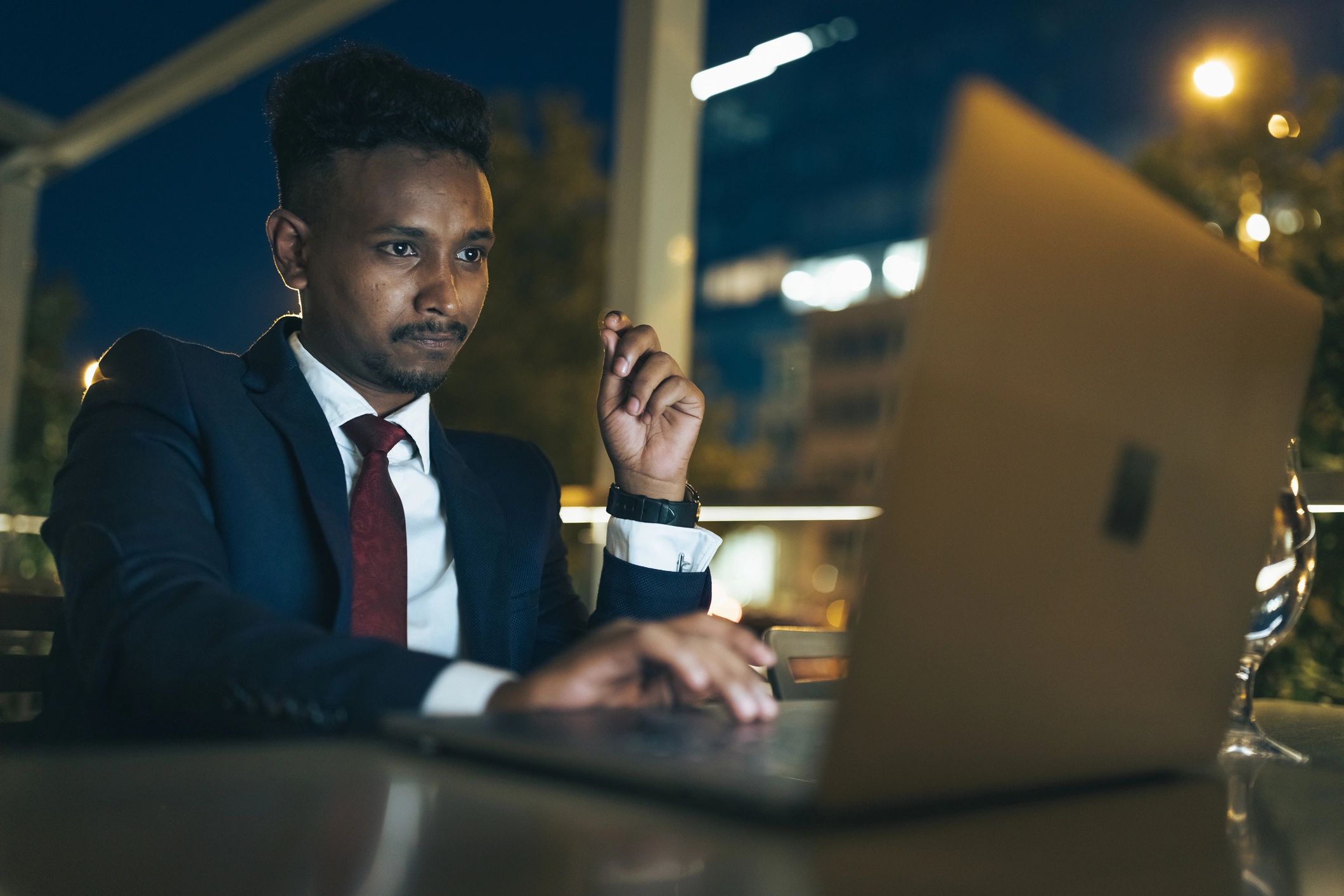 Professional working on a laptop in a coffee shop