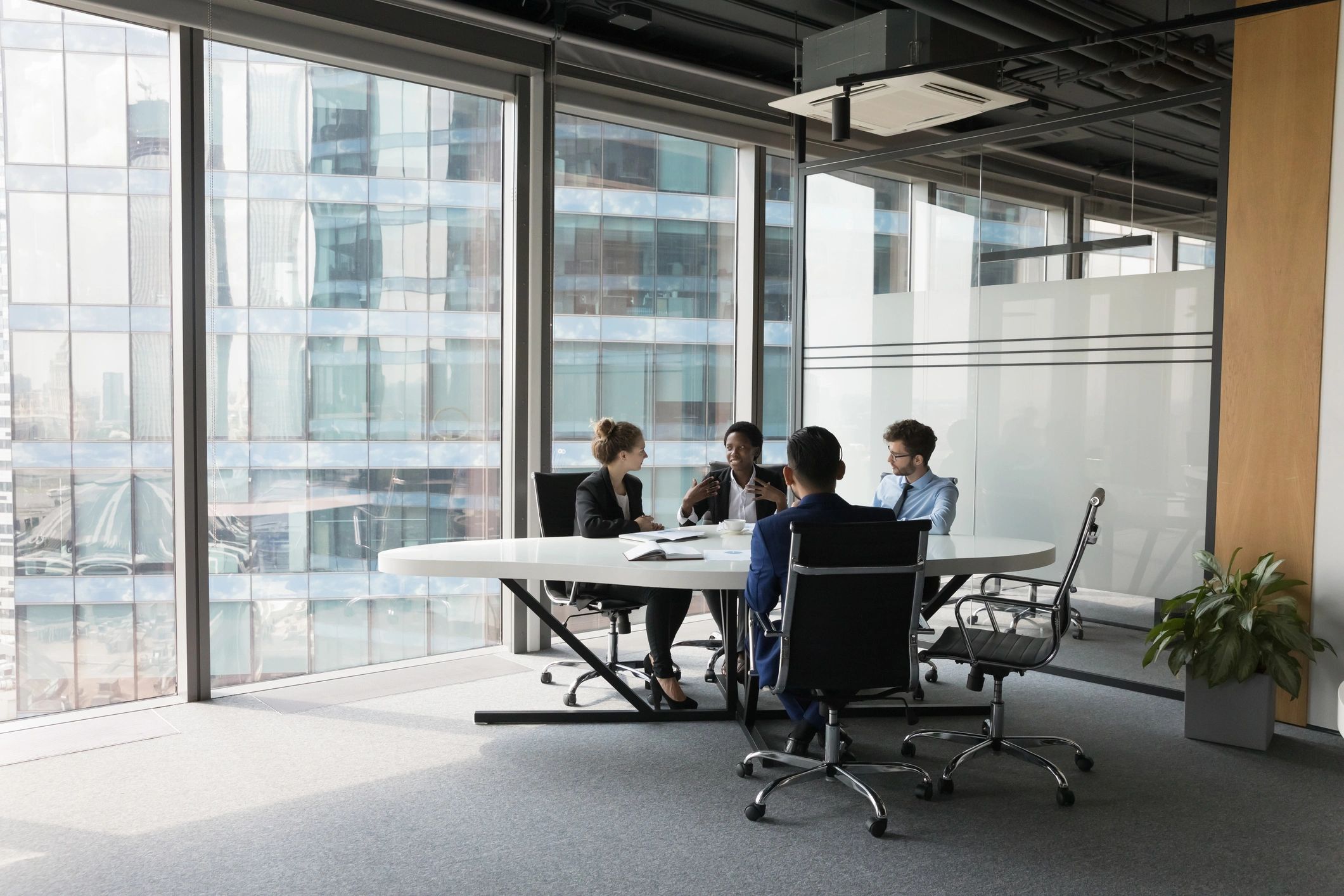 Enterprise team collaborating in a modern meeting room